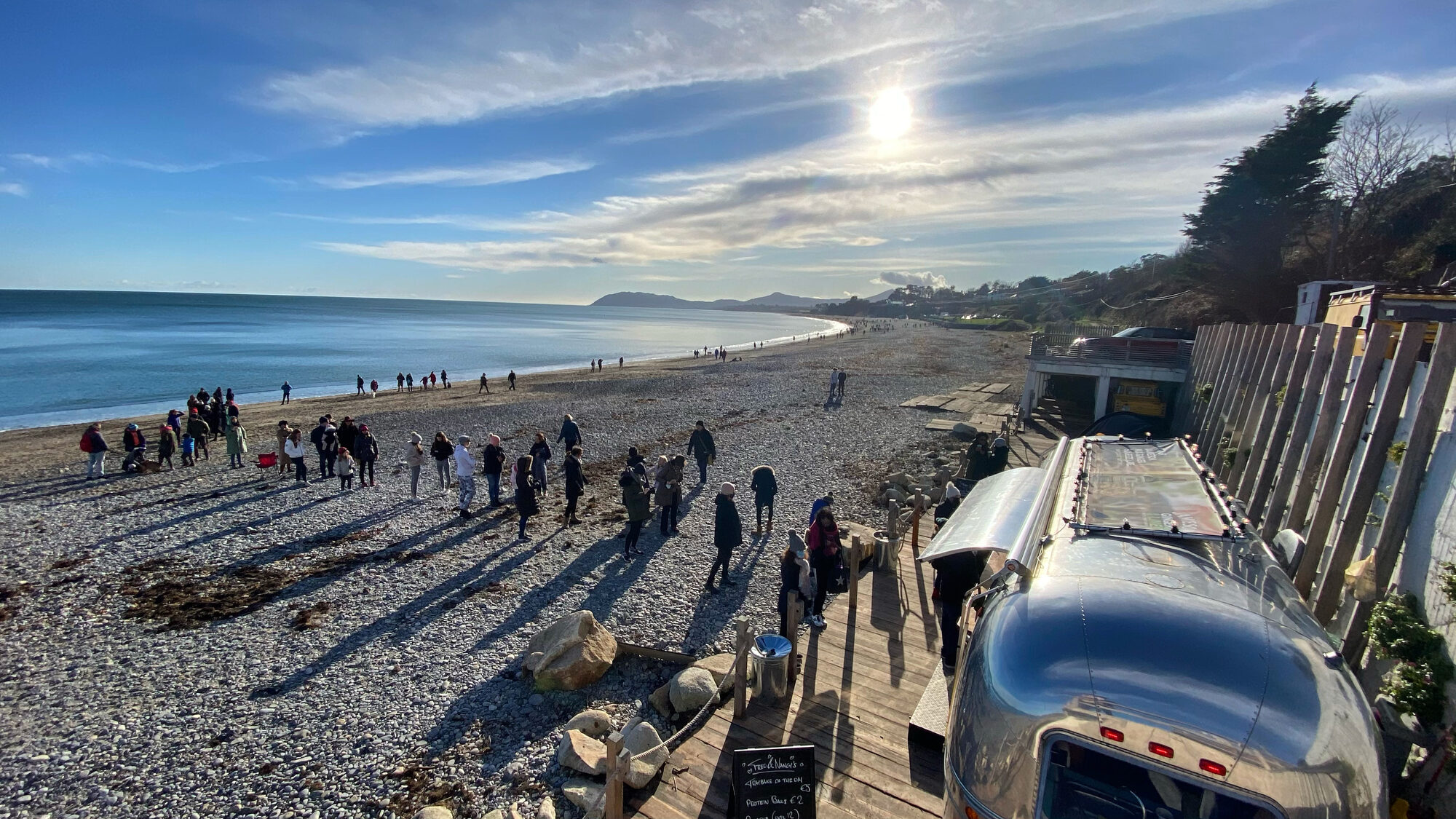 Morning queue for coffee on the beach.