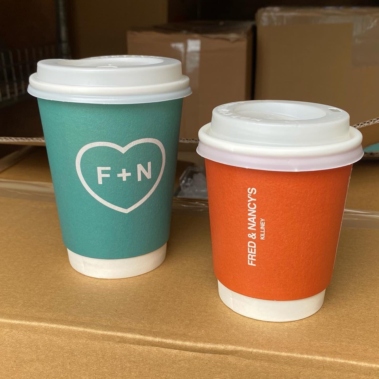Two branded cups together.