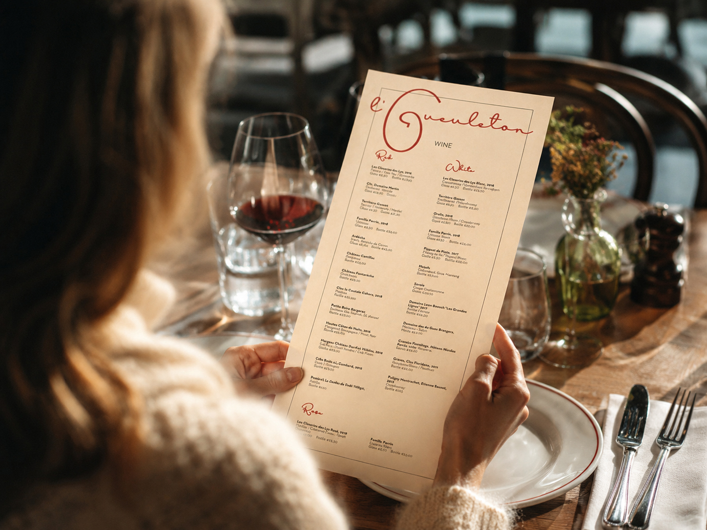 Wine menu booklet with cream stock and bistro typography.