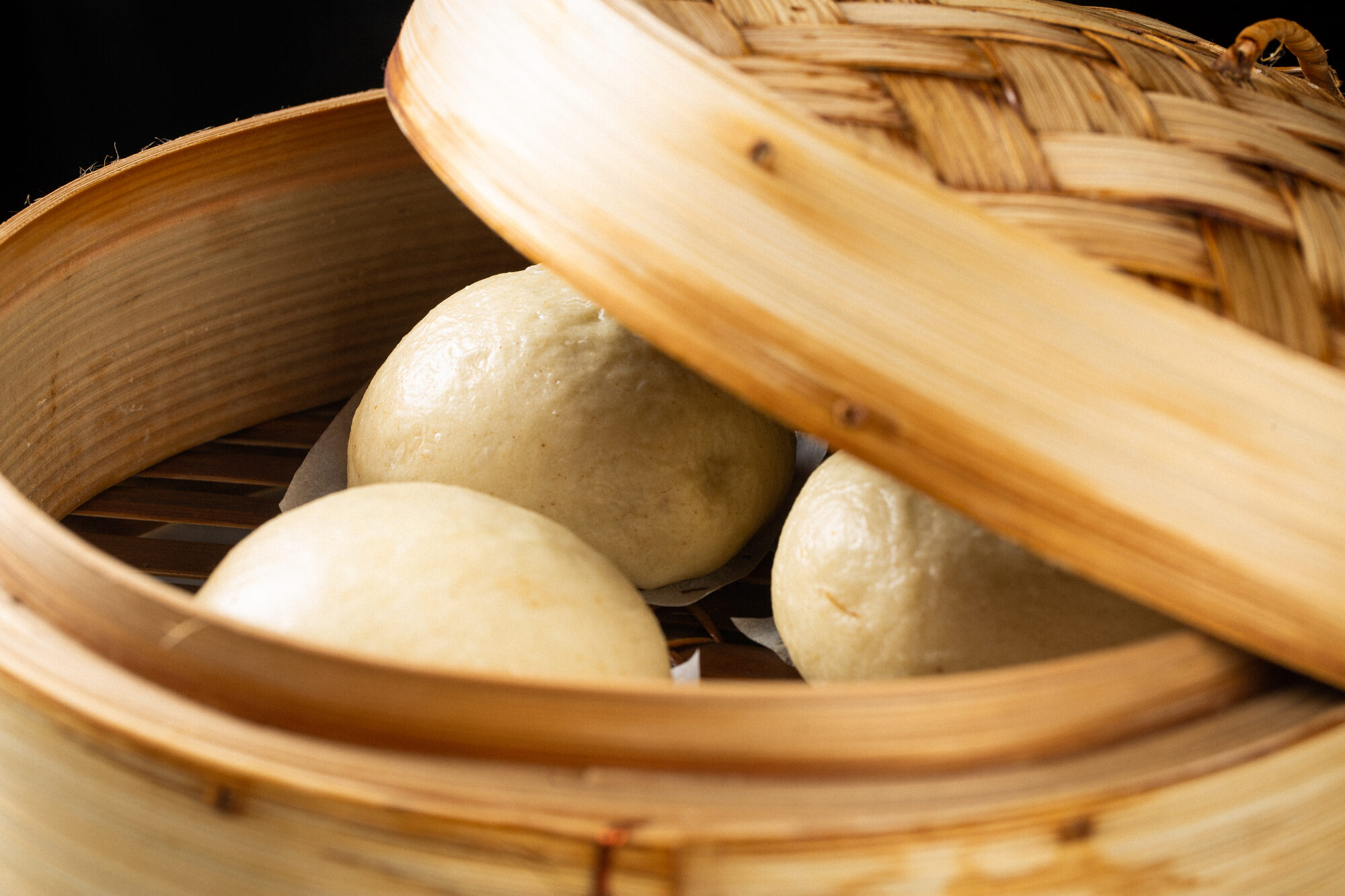 A bamboo steamer in service — process detail.