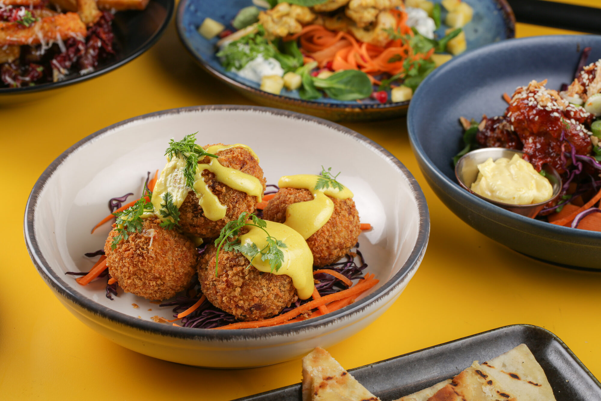 A group of bowls showing menu range and abundance.