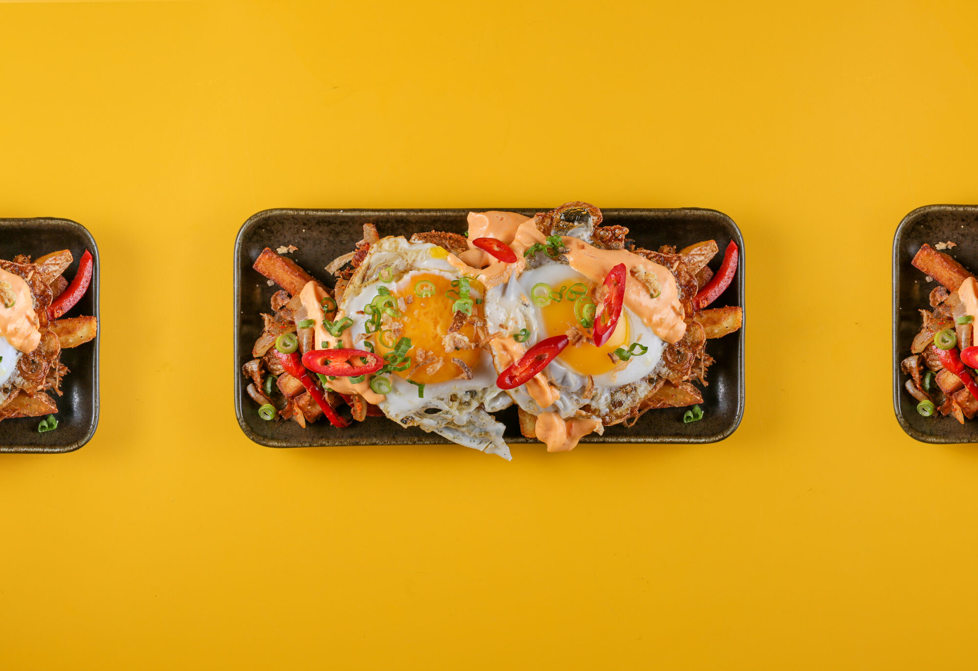 Duck spice bag dish, graphic and playful on yellow.